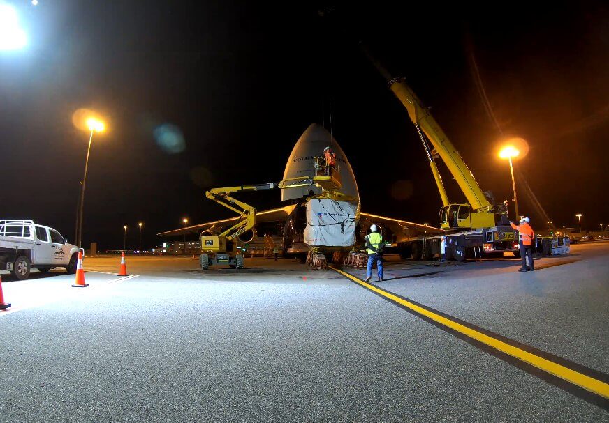 A large cargo is lifted from the plane by crane