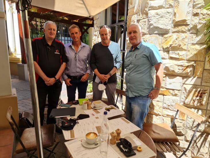 Four men in a cafe