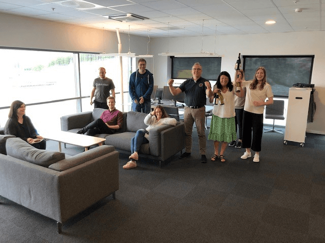 Group of people celebrating in the office