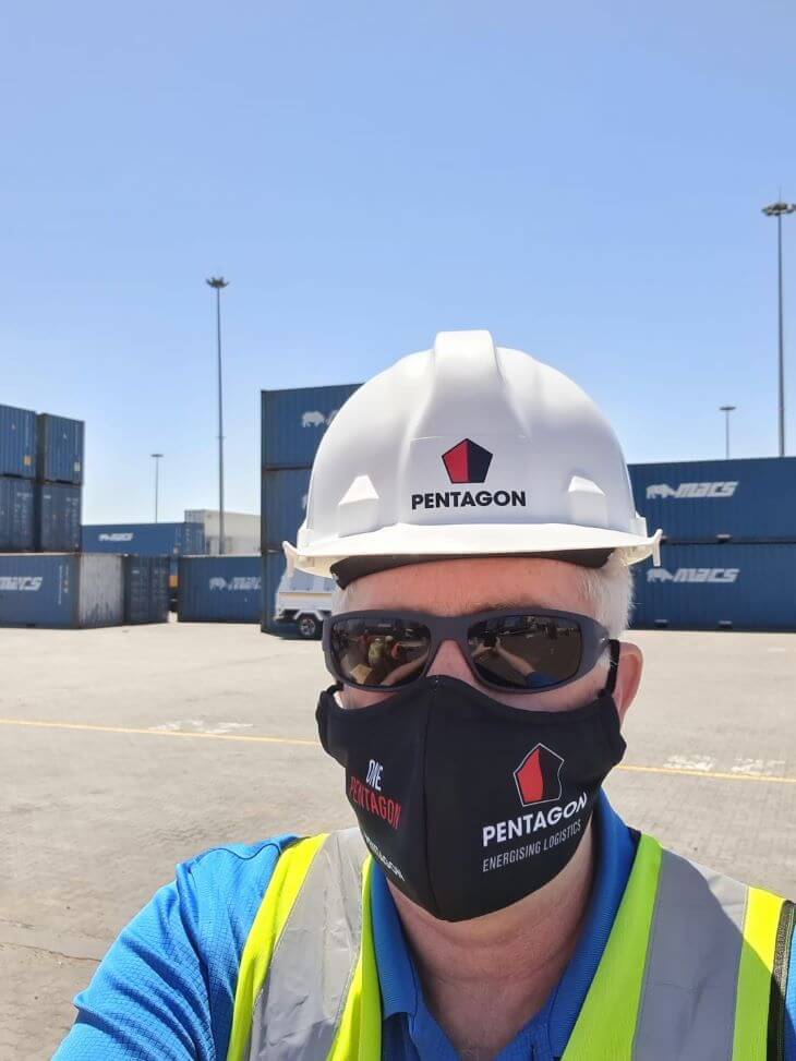 Worker in helmet and a protective mask