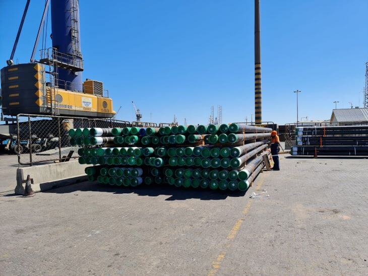 Pipes stacked in the square at the port