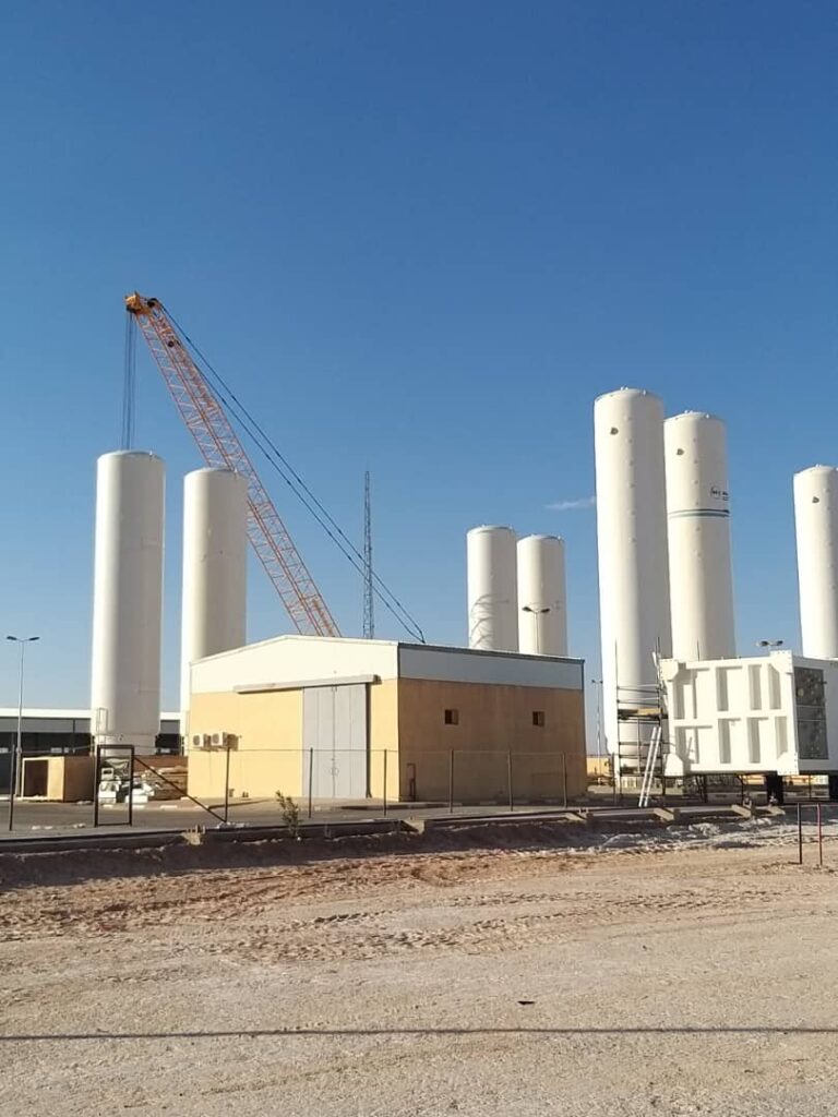 The crane prepares the storage tanks for transport