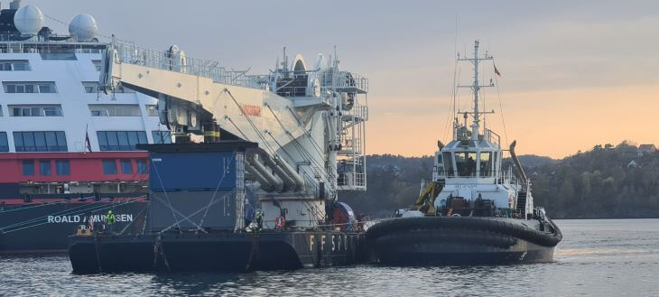 Crane prepared for transport on the pontoon barge in the port