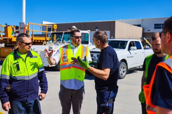 Workers talking to each other