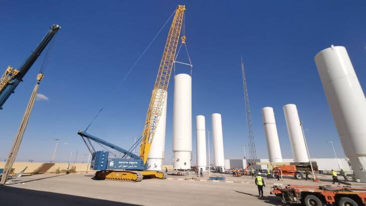 The crane prepares the storage tanks for transport