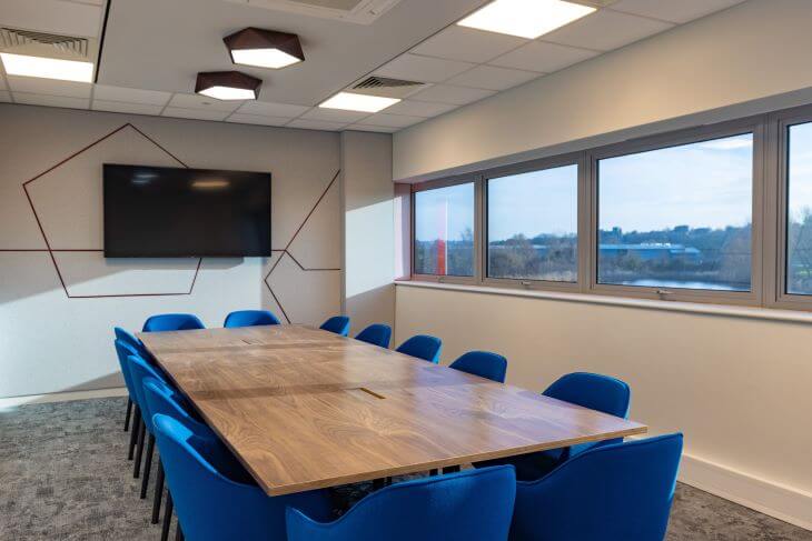 Table with blue chairs in the conference room