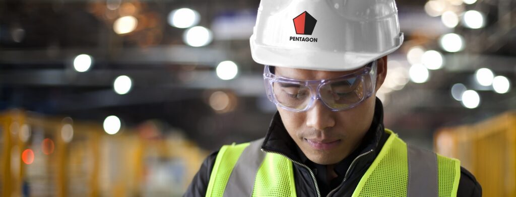 Worker in a helmet and protective glasses