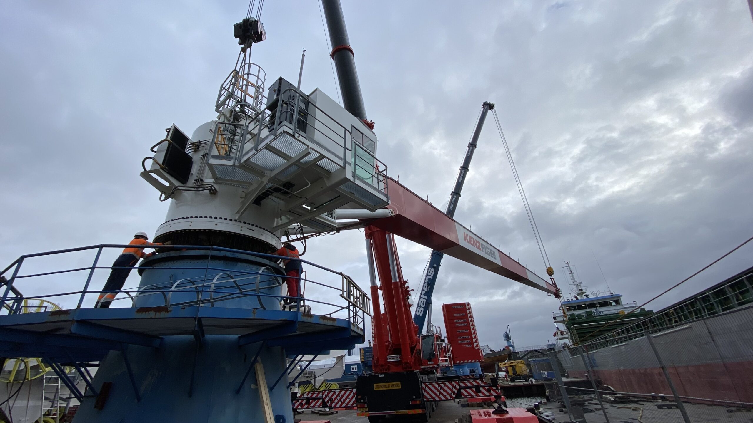 A crane that loads cargo onto a ship in port