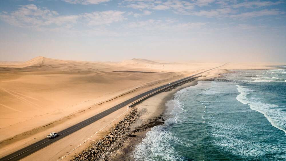 Road between desert and sea