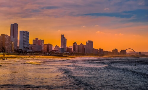 View of Durban city by the sea at sunset